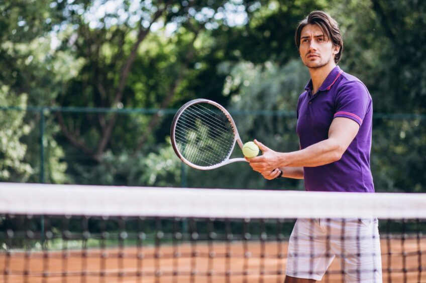 Young Man playing Tennis